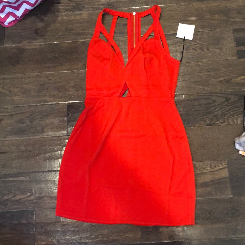 NWT red dress. Cut outs in front and back